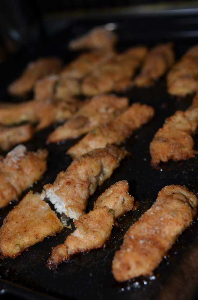 Chicken pineapple with yogurt sauce laid out on a baking tray