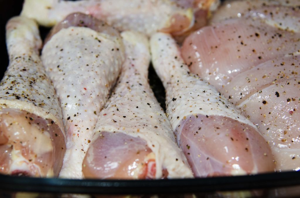 Chicken pieces seasoned with salt and pepper